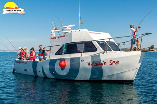 a group of people on a boat in the water at #097 Casa Antonieta 2 by Home Holidays in Albufeira