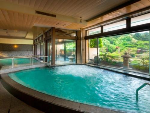 a large swimming pool in a house at Bessho Sasa in Fujiyoshida