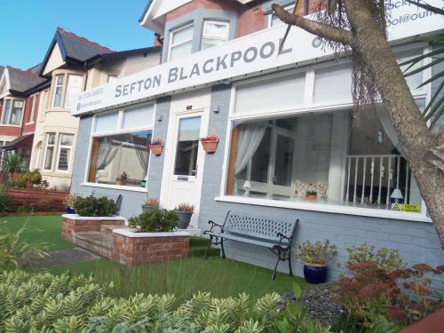 a building with a bench in front of it at The Sefton Blackpool in Blackpool