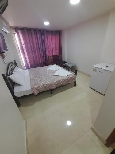 A bed or beds in a room at Farah Plaza Hostel &Hotel Apartments