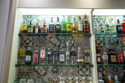 a refrigerator filled with lots of bottles of alcohol at Casa Portofino Rooms&Breakfast in Cesenatico
