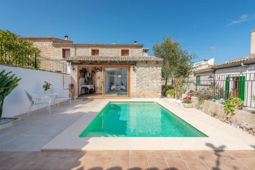 a pool in the backyard of a villa at Es Pujols in Campanet