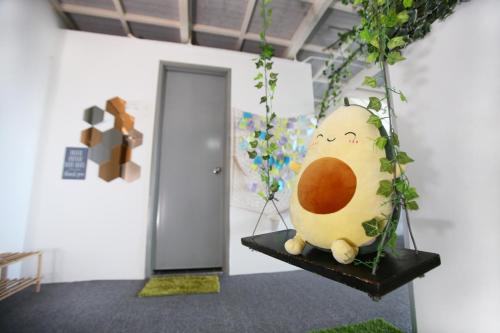 a egg hanging on a shelf in a room at Private Forest Camp - Cinema, Hammock, Swing at CEO Penang in Bayan Lepas