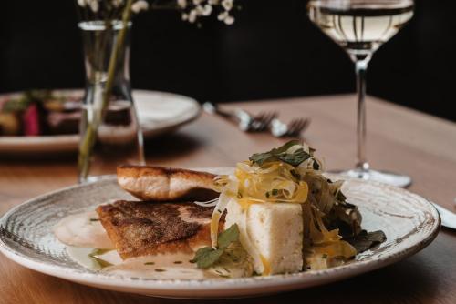 a plate of food on a wooden table at Jaglhof in Gamlitz