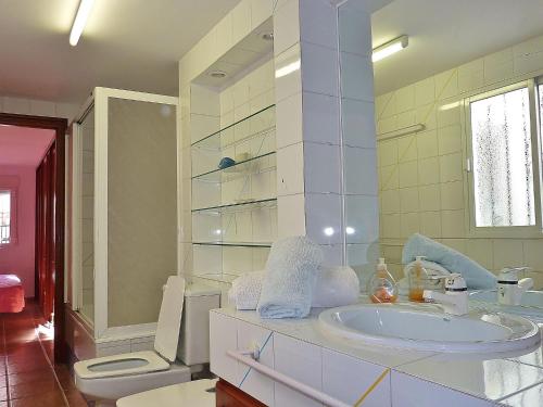 a bathroom with a sink and a toilet at Holiday Home Mijas-Costa near Beach in La Cala de Mijas