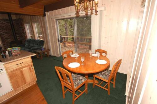 a dining room with a wooden table and chairs at 0665 Yucatan in South Lake Tahoe
