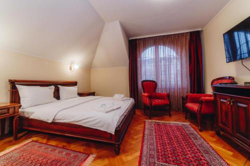 Postel nebo postele na pokoji v ubytování Hotel Madison Kragujevac