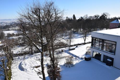 an aerial view of a house in the snow at Schlosshotel Kassel in Kassel
