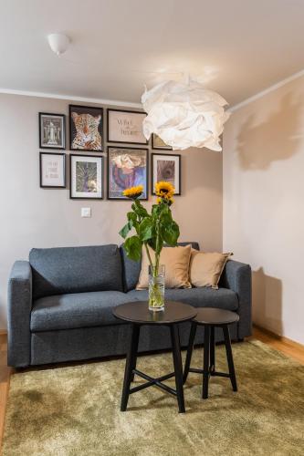 a living room with a couch and a table at Vila Valentina in Ljubljana