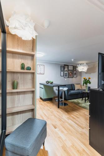 a living room with a couch and a table at Vila Valentina in Ljubljana