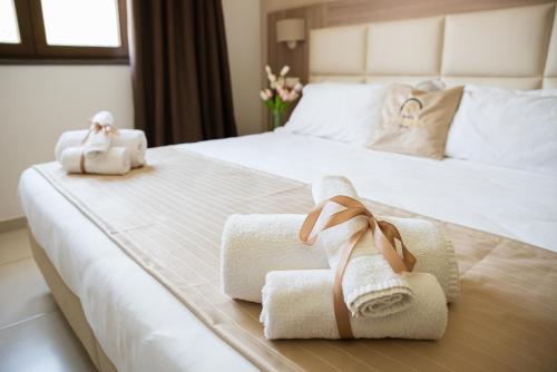 a hotel room with towels on a bed at Hotel St. Giorgio in Castel San Giorgio