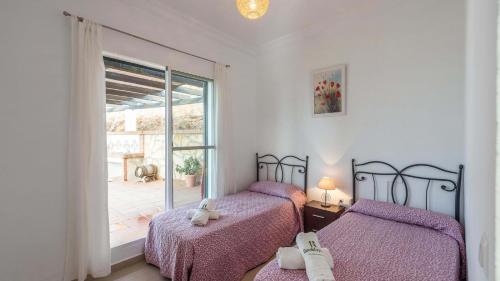 Postel nebo postele na pokoji v ubytování Villa en Lagos Bajo Vélez-Málaga by Ruralidays