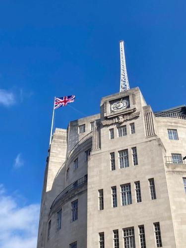 a building with a clock tower and a flag on it at Astor Court Hotel in London