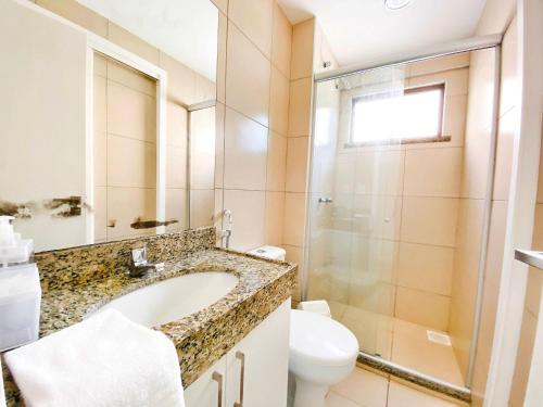 a bathroom with a sink and a toilet at Beverly Hills por Be My Guest in Aquiraz