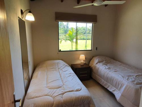 Cama o camas de una habitación en Casa con Piscina, Quincho, Cancha de Futbol/Volley