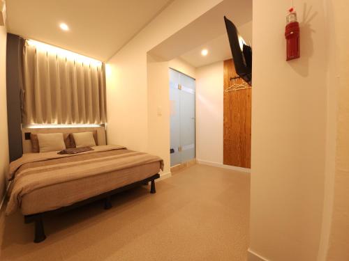 Postel nebo postele na pokoji v ubytování OYO Hostel Myeongdong 3