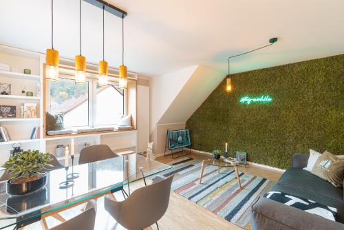 TV a/nebo společenská místnost v ubytování Waldbewohner Apartments / Fuchs