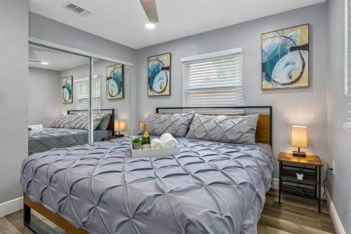 a bedroom with a large bed in a room at Cozy & Fully Renovated FREE Heated Pool Home! in Largo