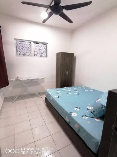 Katil atau katil-katil dalam bilik di RIZQI HOMESTAY PUTRAJAYA