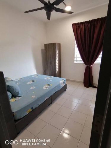 Katil atau katil-katil dalam bilik di RIZQI HOMESTAY PUTRAJAYA