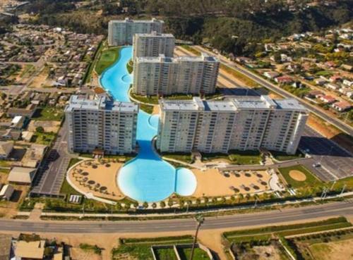 an aerial view of a city with buildings and a river at Vista Marina Laguna Vista Algarrobo in Algarrobo