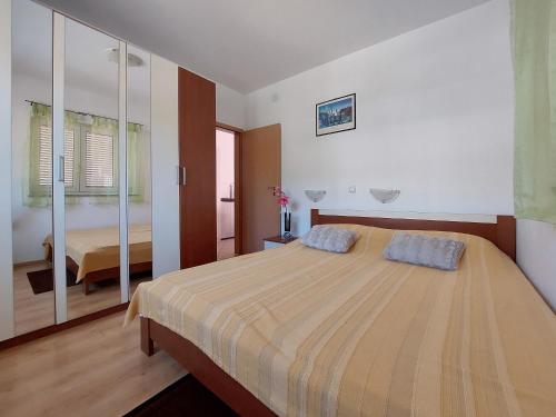 Postel nebo postele na pokoji v ubytování Apartment Niko