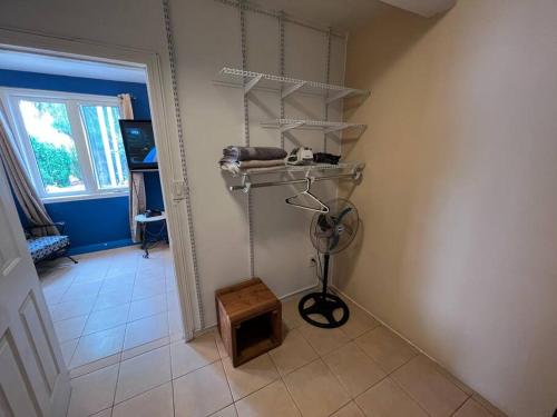 a corner of a room with a shelf and a floor at Apartment Rosarito Beach Downtown (D) in Rosarito