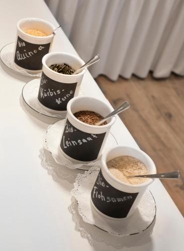 four cups of coffee sitting on a table at Hotel Goldenes Lamm in Idstein