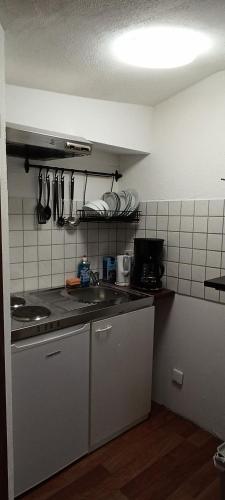 a kitchen with a sink and a counter top at Monteurswohnungen in Kirchhain zentral in Kirchhain