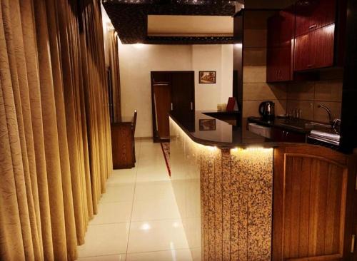 a kitchen with a counter and a counter top at BARADA Hotel- فندق بردى in Qaryat al Bulush