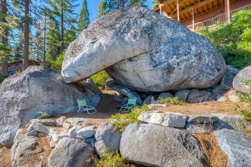a large boulder sitting on top of some rocks at Cascade Charms in South Lake Tahoe