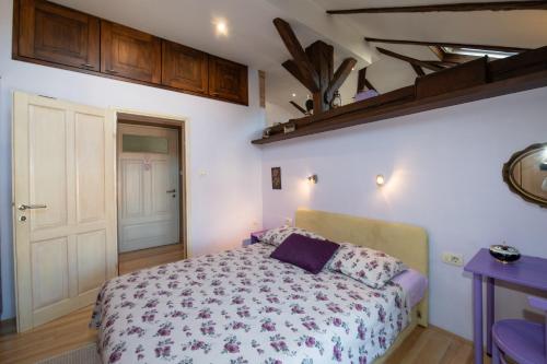 a bedroom with a bed in a room at Apartment Vanja in Opatija