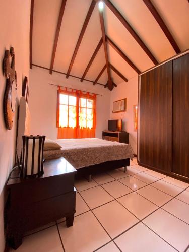 Una cama o camas en una habitación de Búzios com Estilo