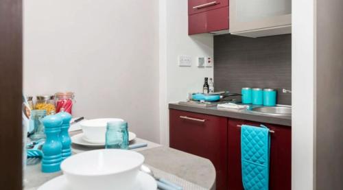 a kitchen with a sink and a counter top at Stunning Apartments at Dashwood Studios in London in London