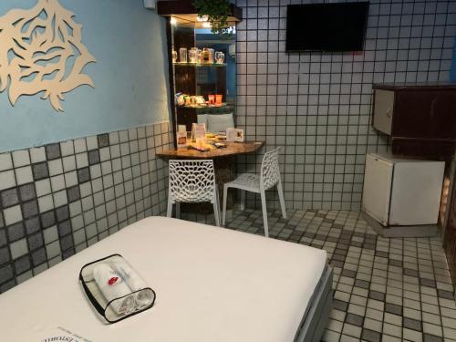 Televisyen dan/atau pusat hiburan di Motel Estoril (Adult Only)