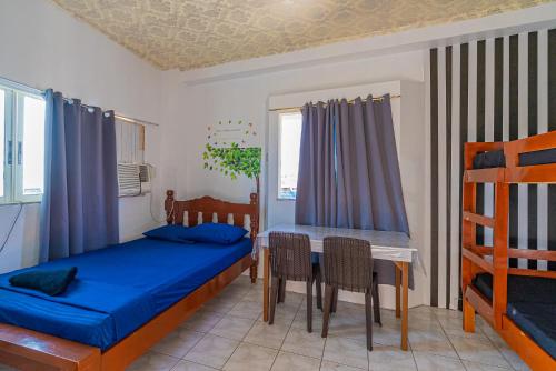 Postel nebo postele na pokoji v ubytování Pier La Casa Homestay Building
