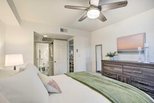a bedroom with a bed and a ceiling fan at Chic Phoenix Condo Pool Access, Close to Hiking in Phoenix
