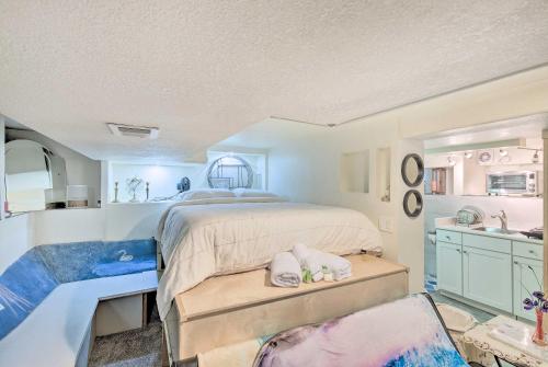 a bedroom with a large bed and a sink at Steps to City Park and Restaurants Denver Studio in Denver