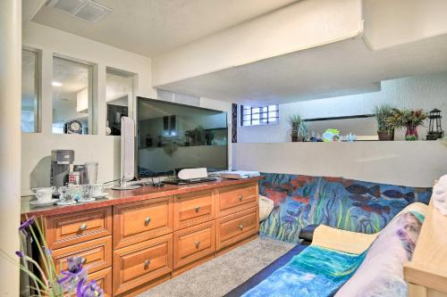 a bathroom with a sink and a large mirror at Steps to City Park and Restaurants Denver Studio in Denver