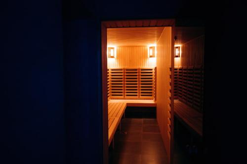 a walk in closet with two lights on at GasthauS & SPA in Bukovel