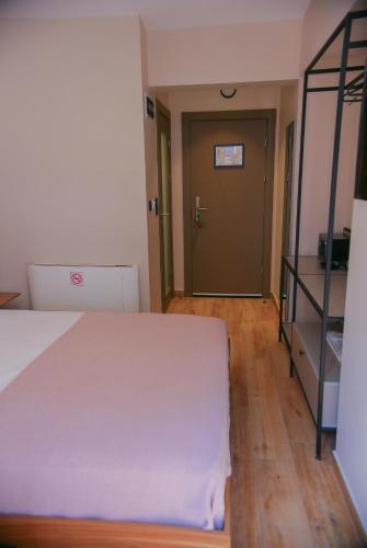 Postel nebo postele na pokoji v ubytování Şenyıldız Hotel