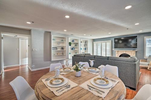 a dining room with a table and a couch at Less Than 1 Mi to Mussel Rock Park! Cliffside Pacifica Gem in Pacifica