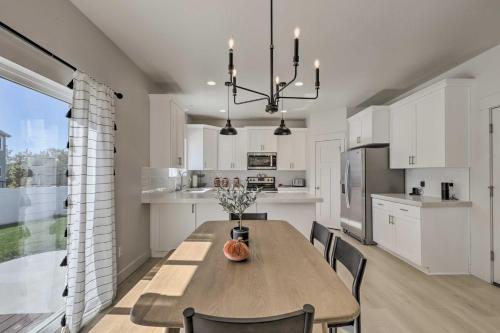a kitchen and dining room with a wooden table and chairs at Lovely Vineyard Getaway Less Than 1 Mi to Utah Lake! in Vineyard