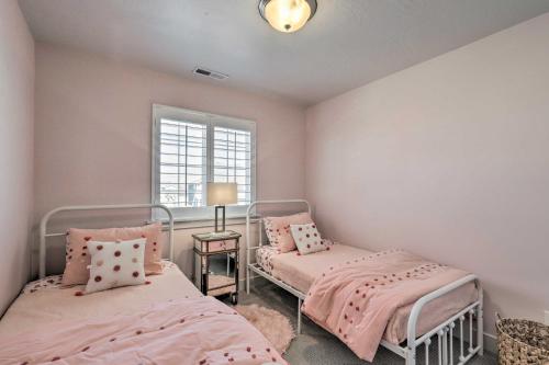 a bedroom with two beds and a window at Lovely Vineyard Getaway Less Than 1 Mi to Utah Lake! in Vineyard