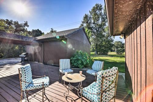 a patio with chairs and a table on a deck at Spacious Seabrook Home with Patio 1 Mi to Beach! in Seabrook