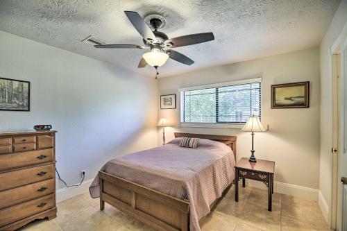 a bedroom with a bed and a ceiling fan at Spacious Seabrook Home with Patio 1 Mi to Beach! in Seabrook