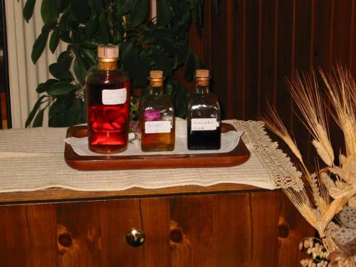 three bottles of alcohol sitting on a tray on a table at Hotel Su Giudeu in Chia