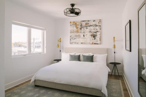 a white bedroom with a white bed and a window at Sonder The Lookout in Nashville