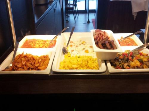 a buffet with different types of food on a table at Landhaus Sundern in Tecklenburg