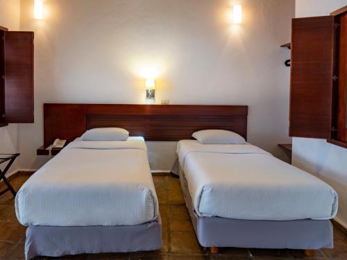 Hotel Casa Real Del Caféにあるベッド